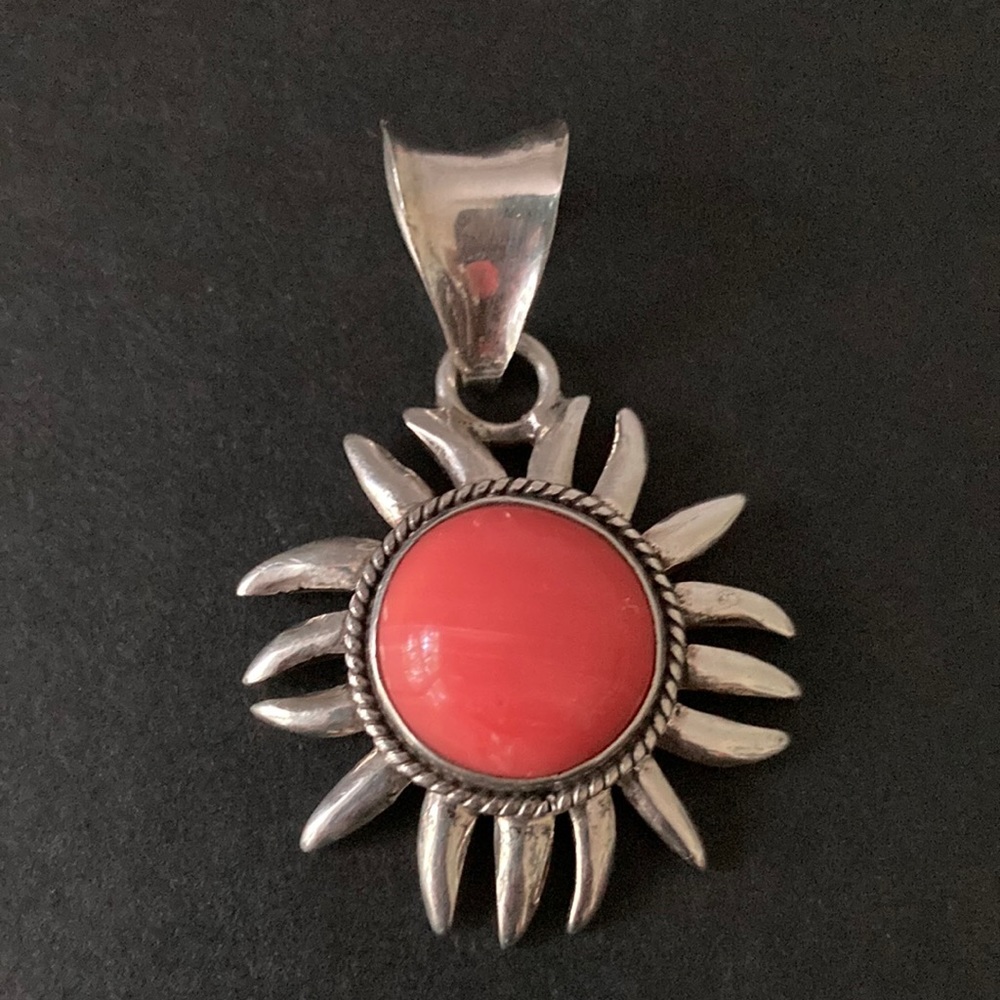 Sterling silver pendant with coral stone
